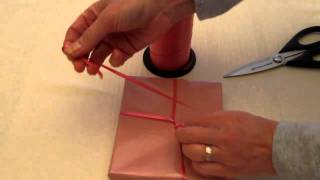 How To Tie A Ribbon On A Gift Part 1 [upl. by Aniham]